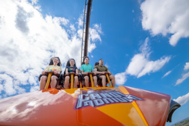 Riders on board Hersheypark's Candymonium roller coaster.
